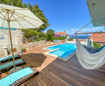 Pool area with the BBQ behind the Pool - Luxury apartment in Lumbarda, Korcula