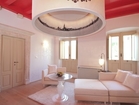 Residence Venice - a living room with a large chandelier in special design